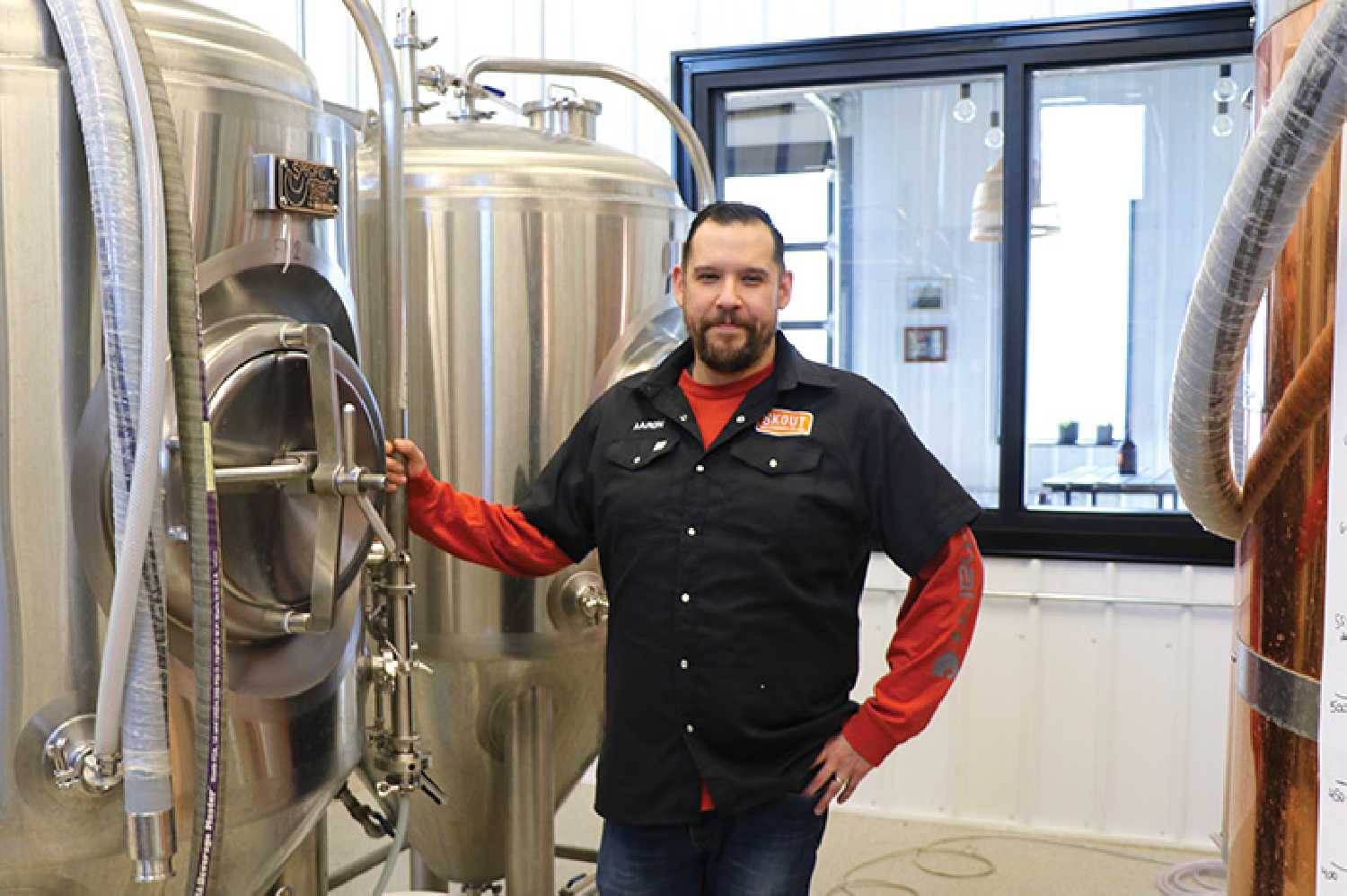 Aaron Grandguillot is the proud owner of Skout Brewing, which will be opening in Moosomin this Friday. Here he stands in the brewing room of the new craft brewery.